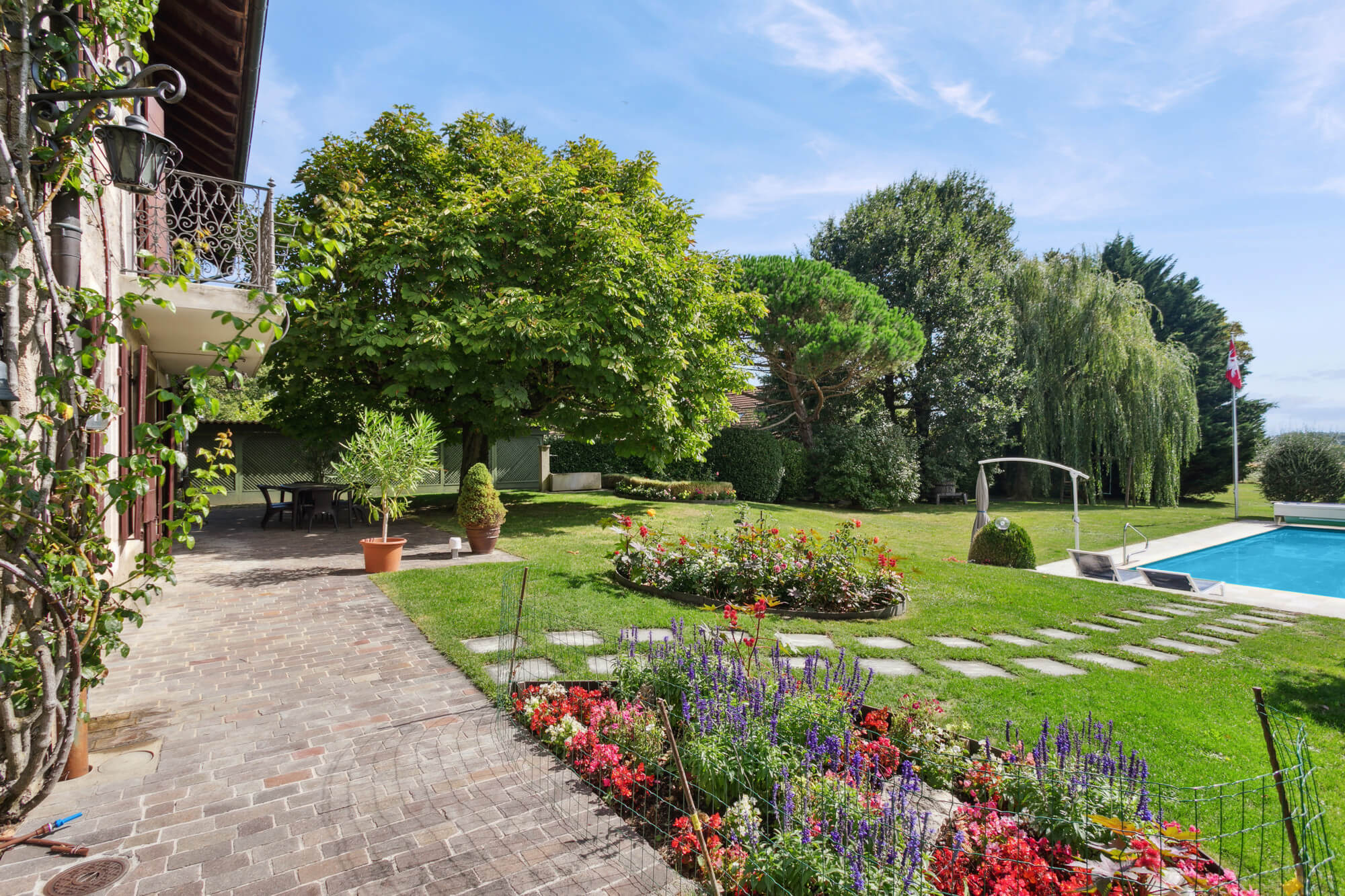 Elegant 19th Century Village-Style Property with Outdoor Pool and Expansive Wooded Grounds